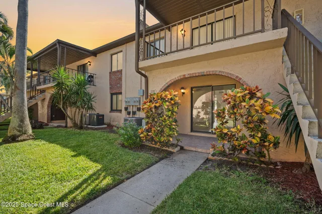 front view of a house with a garden