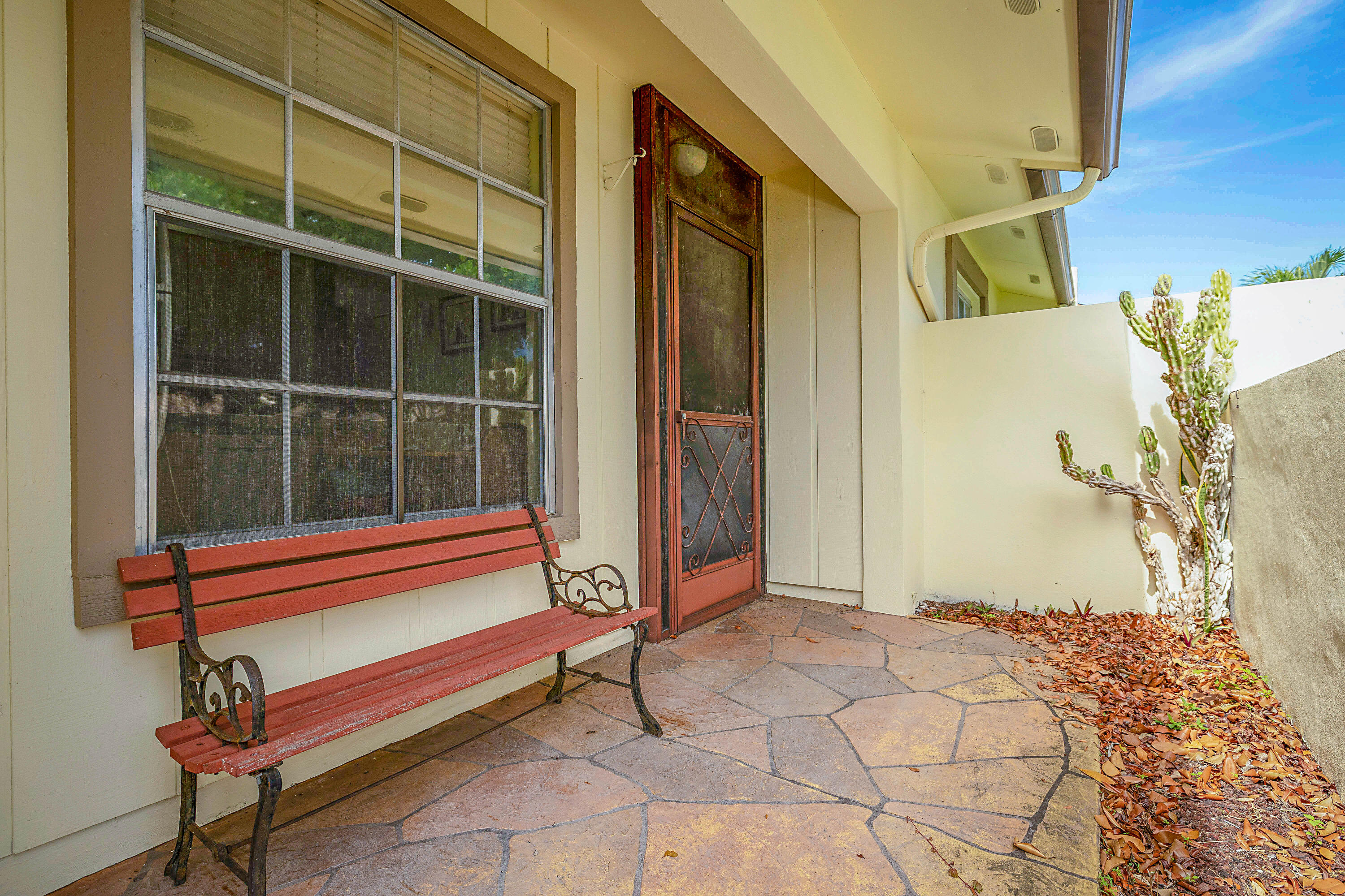 5231 Copperleaf Circle Delray Beach, FL 33484 - Photo 2 of 31 a bench sitting in front of a building