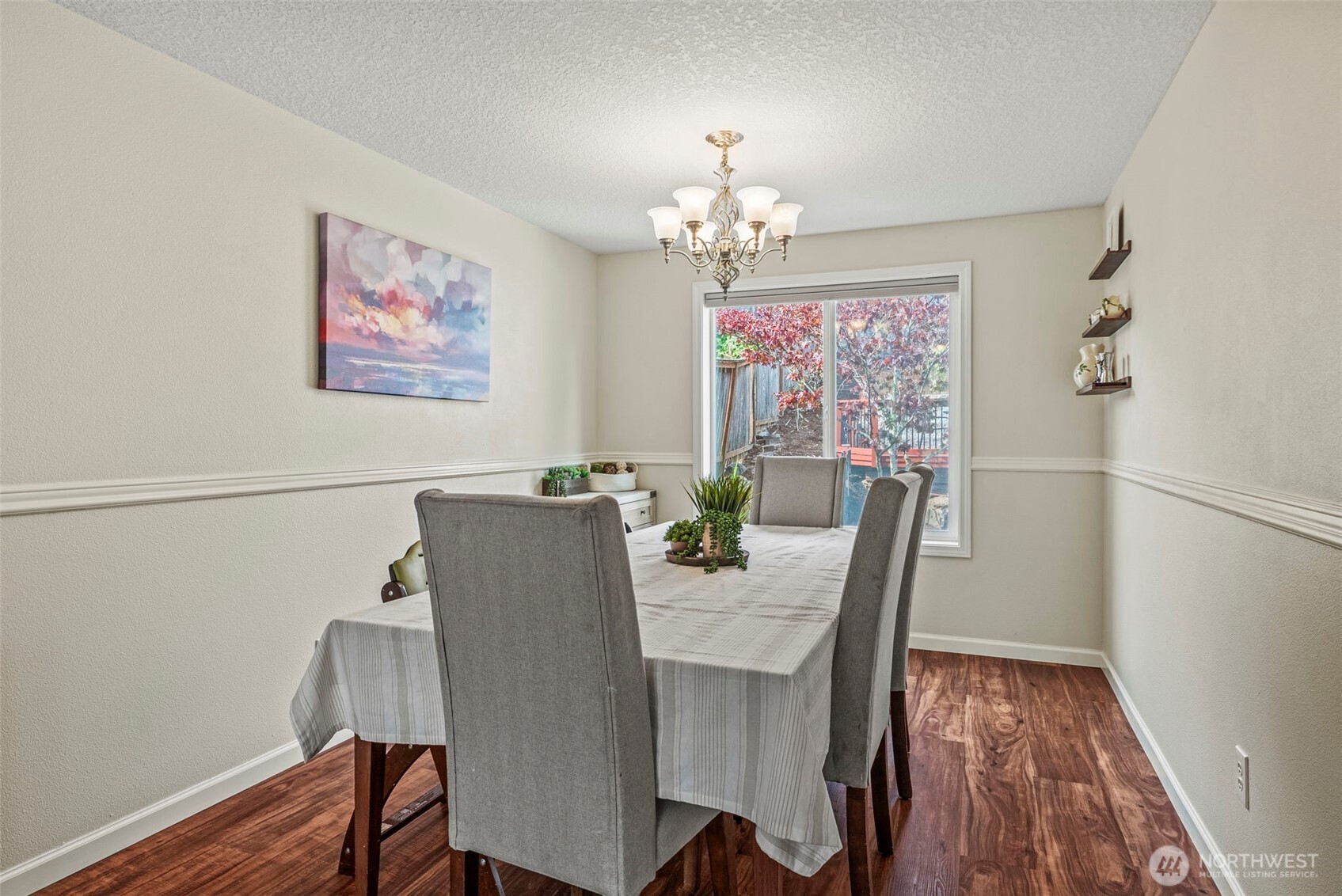 2410 North Heron Drive Ridgefield, WA 98642 - Photo 11 of 40 a view of a dining room with furniture wooden floor and a chandelier