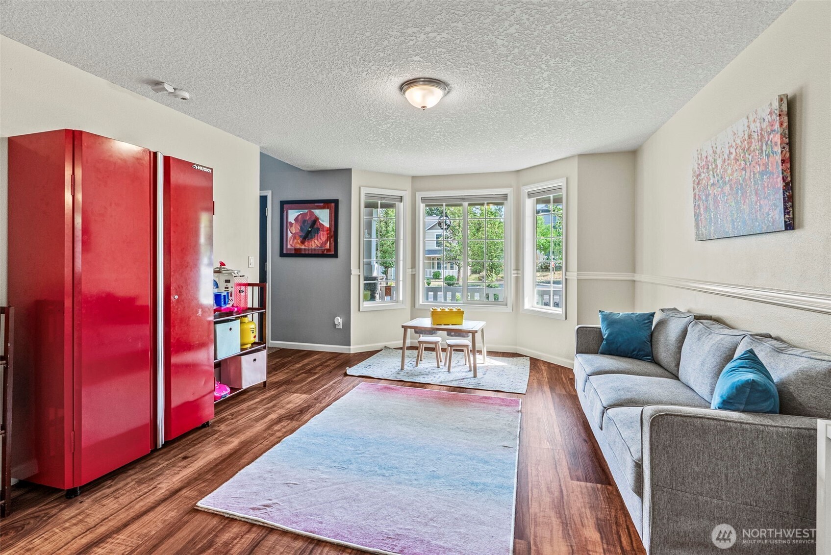 2410 North Heron Drive Ridgefield, WA 98642 - Photo 13 of 40 a living room with furniture and wooden floor
