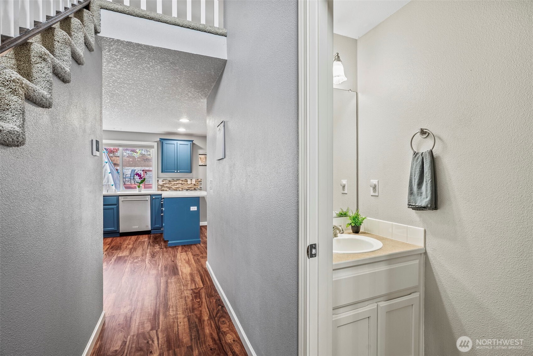2410 North Heron Drive Ridgefield, WA 98642 - Photo 17 of 40 a bathroom with a sink a mirror and shower