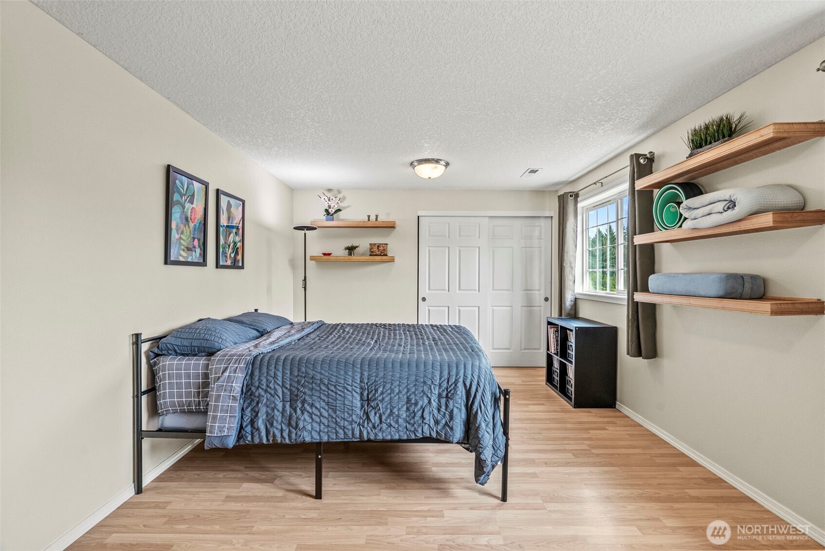 2410 North Heron Drive Ridgefield, WA 98642 - Photo 25 of 40 a bedroom with a bed and a cabinets