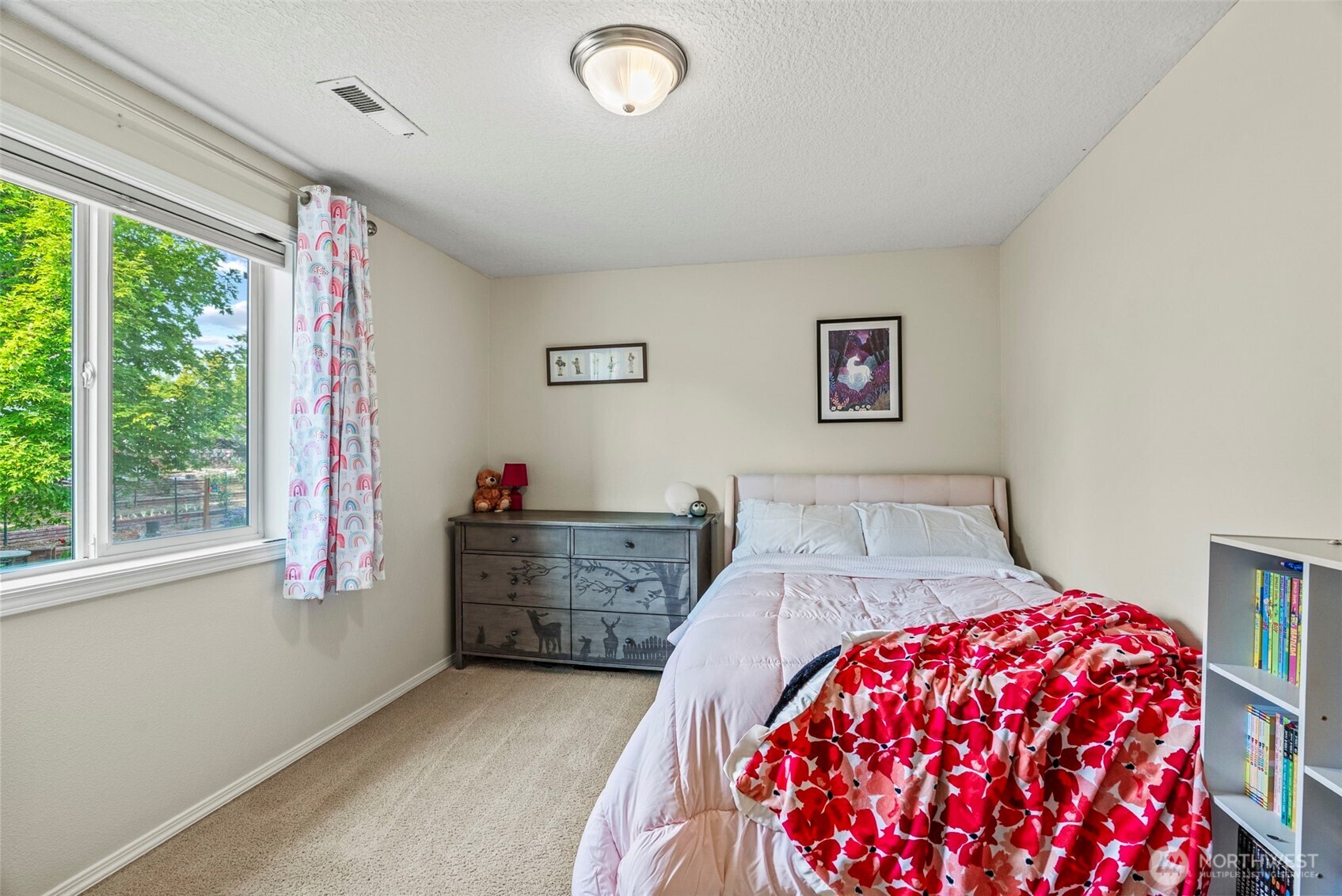 2410 North Heron Drive Ridgefield, WA 98642 - Photo 28 of 40 a bedroom with a bed and a dresser