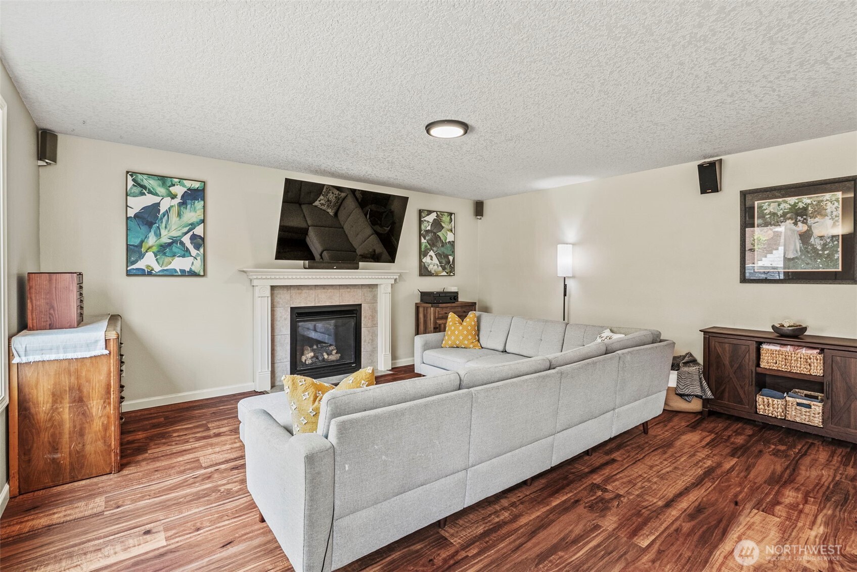 2410 North Heron Drive Ridgefield, WA 98642 - Photo 4 of 40 a living room with furniture a flat screen tv and a fireplace