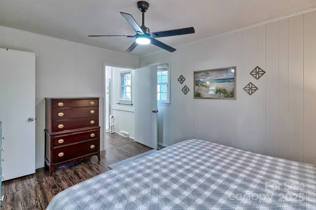 a bedroom with a bed and a dresser