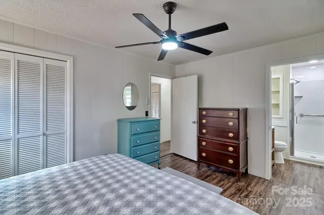 a bedroom with a bed and a dresser