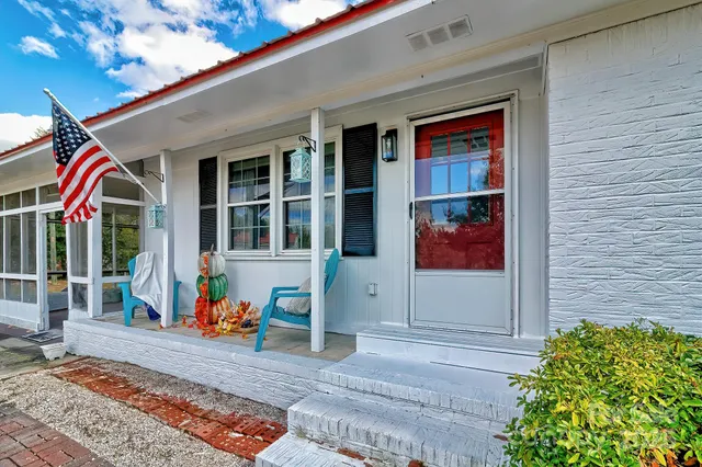 a front view of a house with umbrella