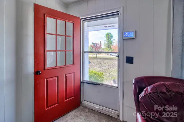 a view of front door with a couch