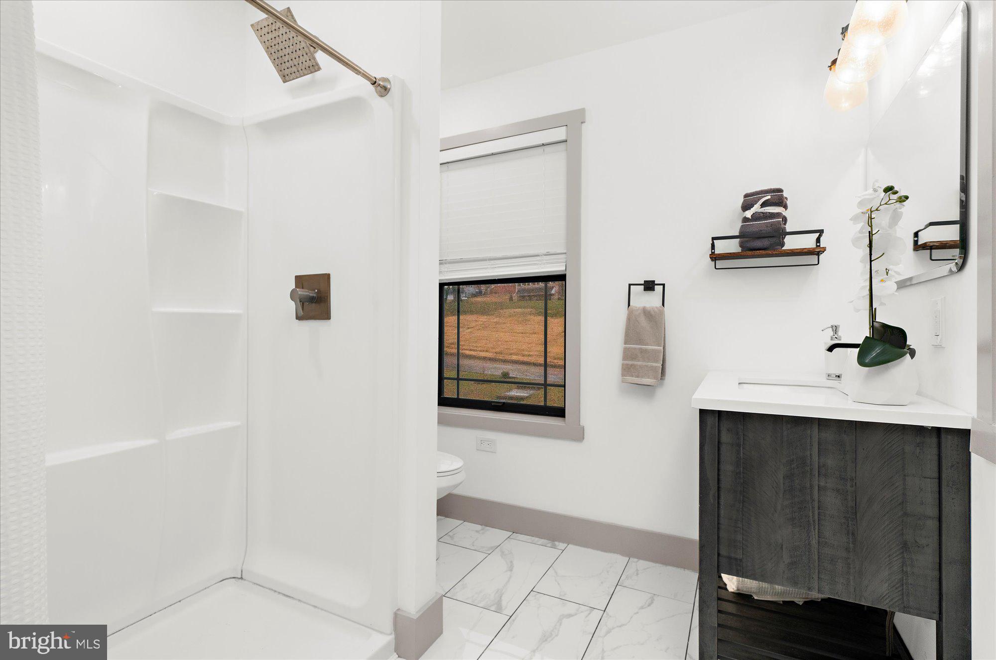 8 Chipmunk Lane Media, PA 19063 - Photo 14 of 51 a bathroom with a sink and a mirror