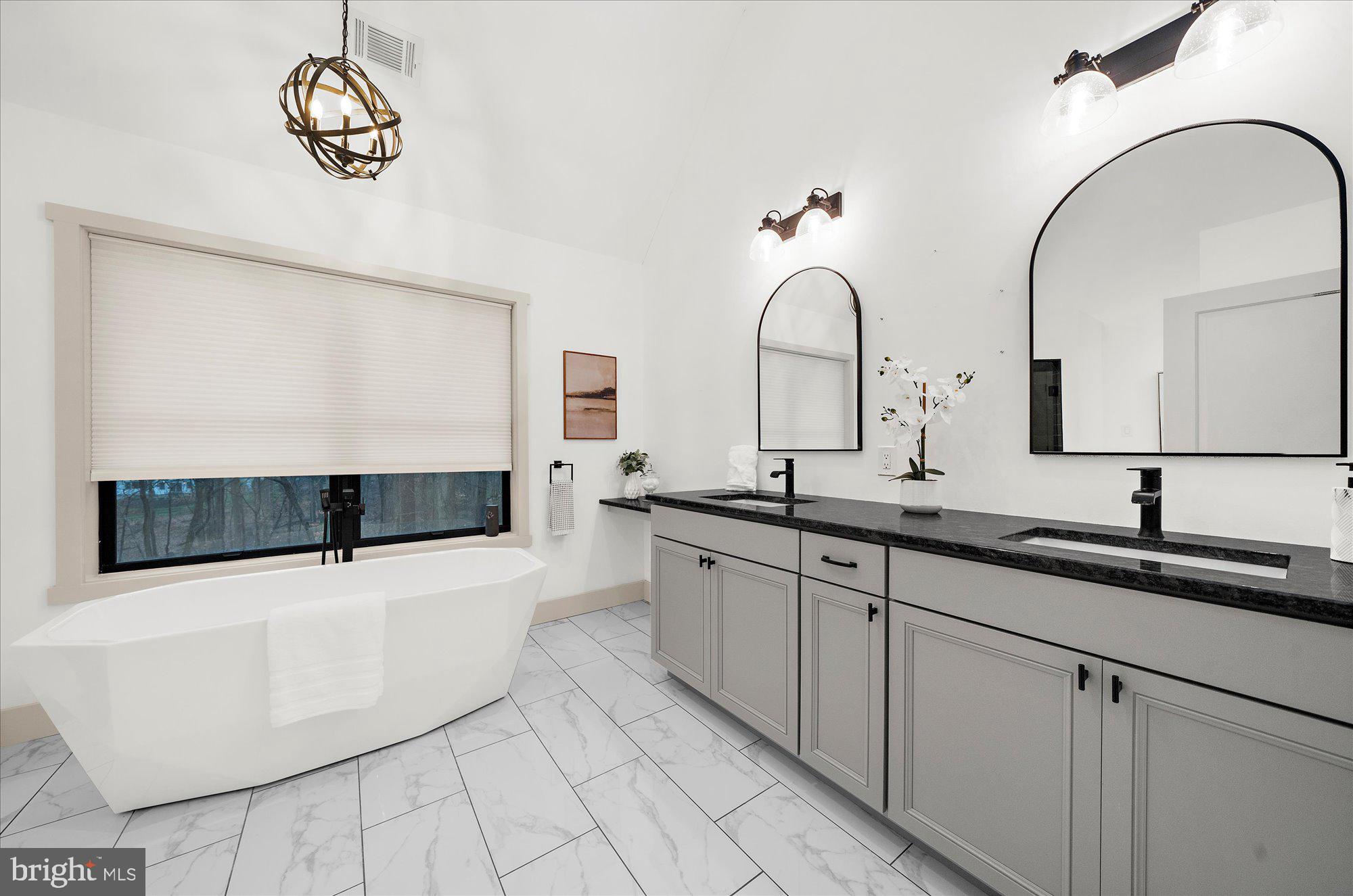8 Chipmunk Lane Media, PA 19063 - Photo 21 of 51 a spacious bathroom with a sink and a mirror