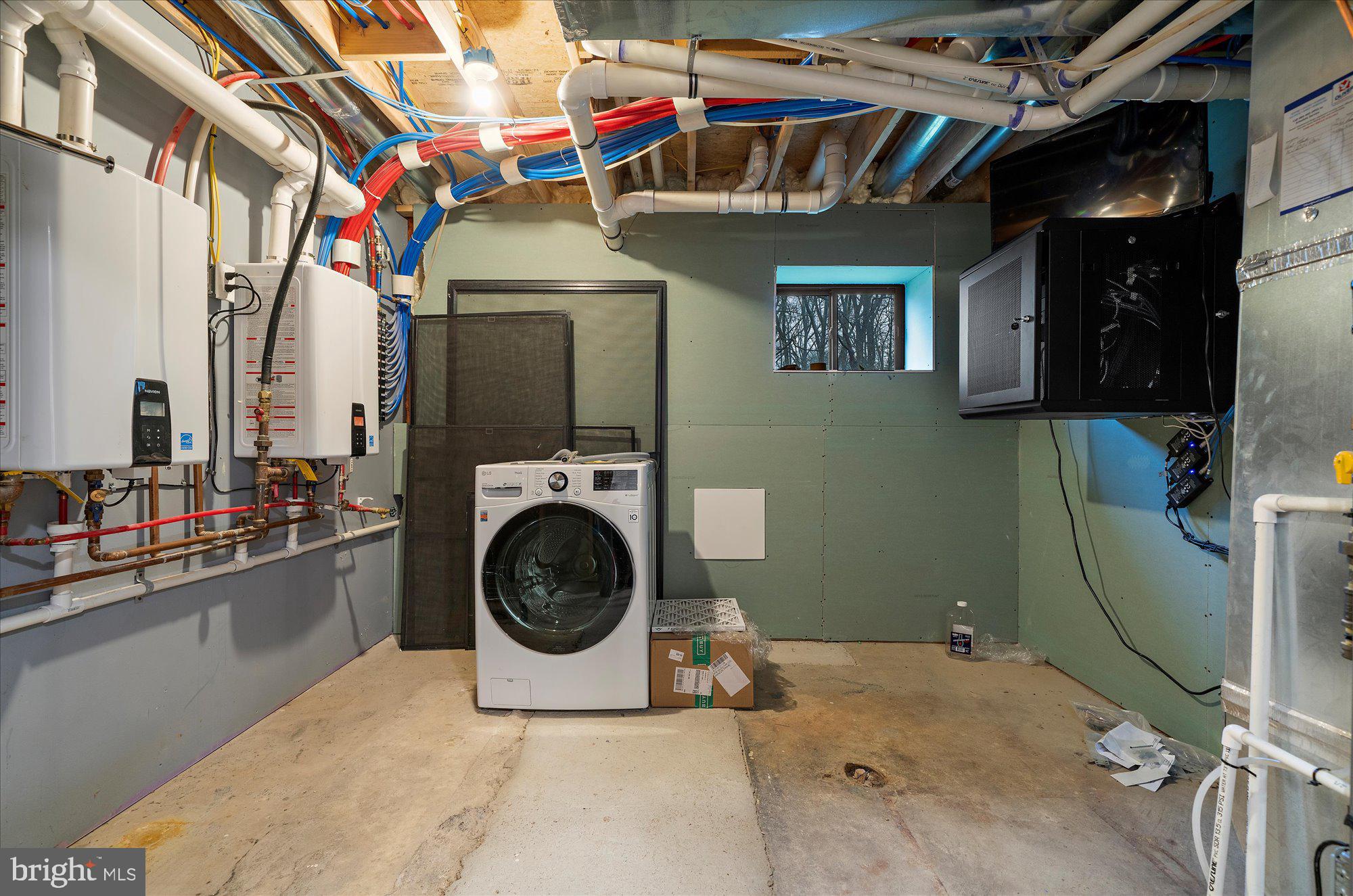 8 Chipmunk Lane Media, PA 19063 - Photo 39 of 51 Lower Level Laundry w/ Tankless Water Heaters