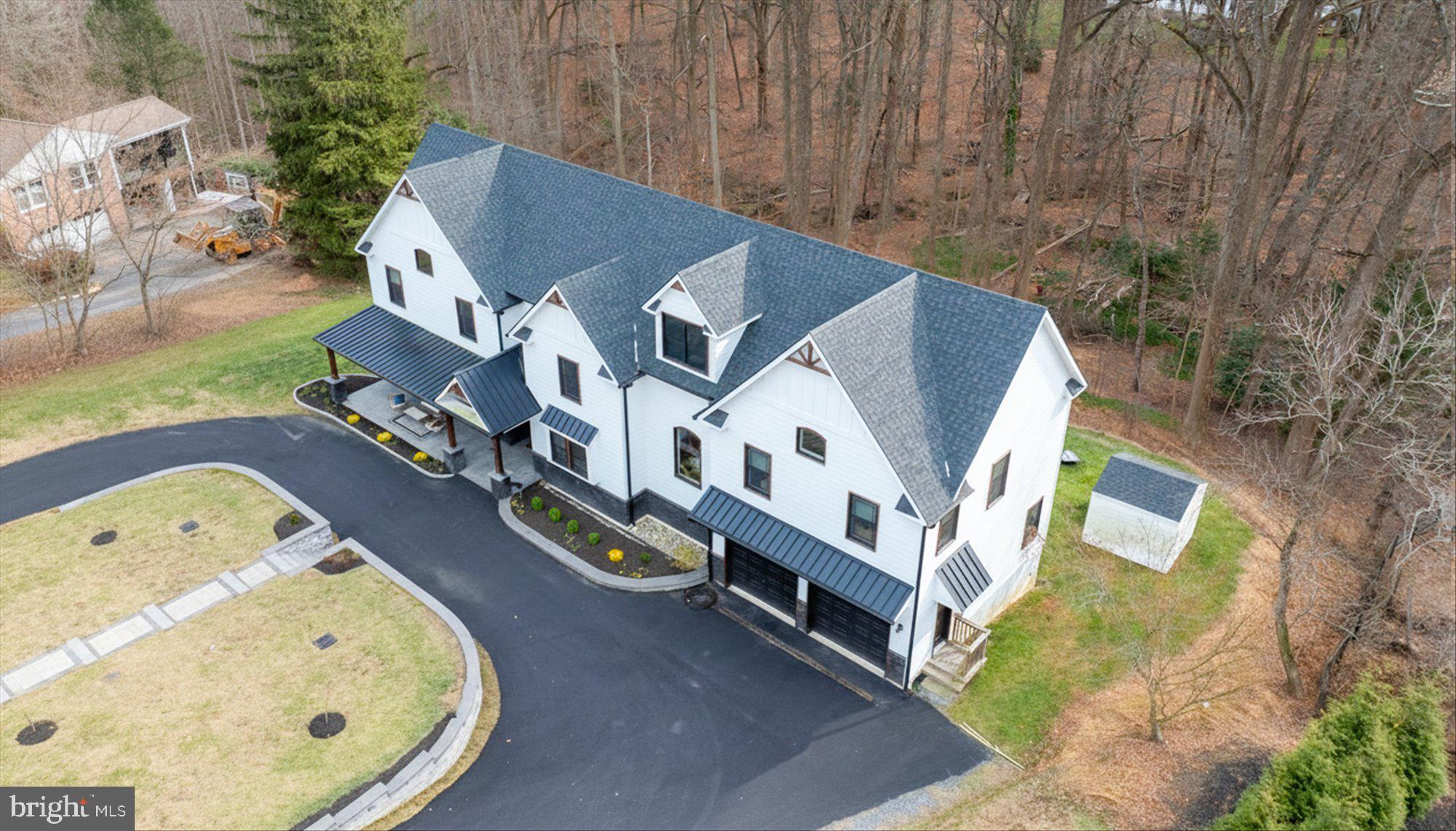 8 Chipmunk Lane Media, PA 19063 - Photo 44 of 51 an aerial view of a house with swimming pool and trees