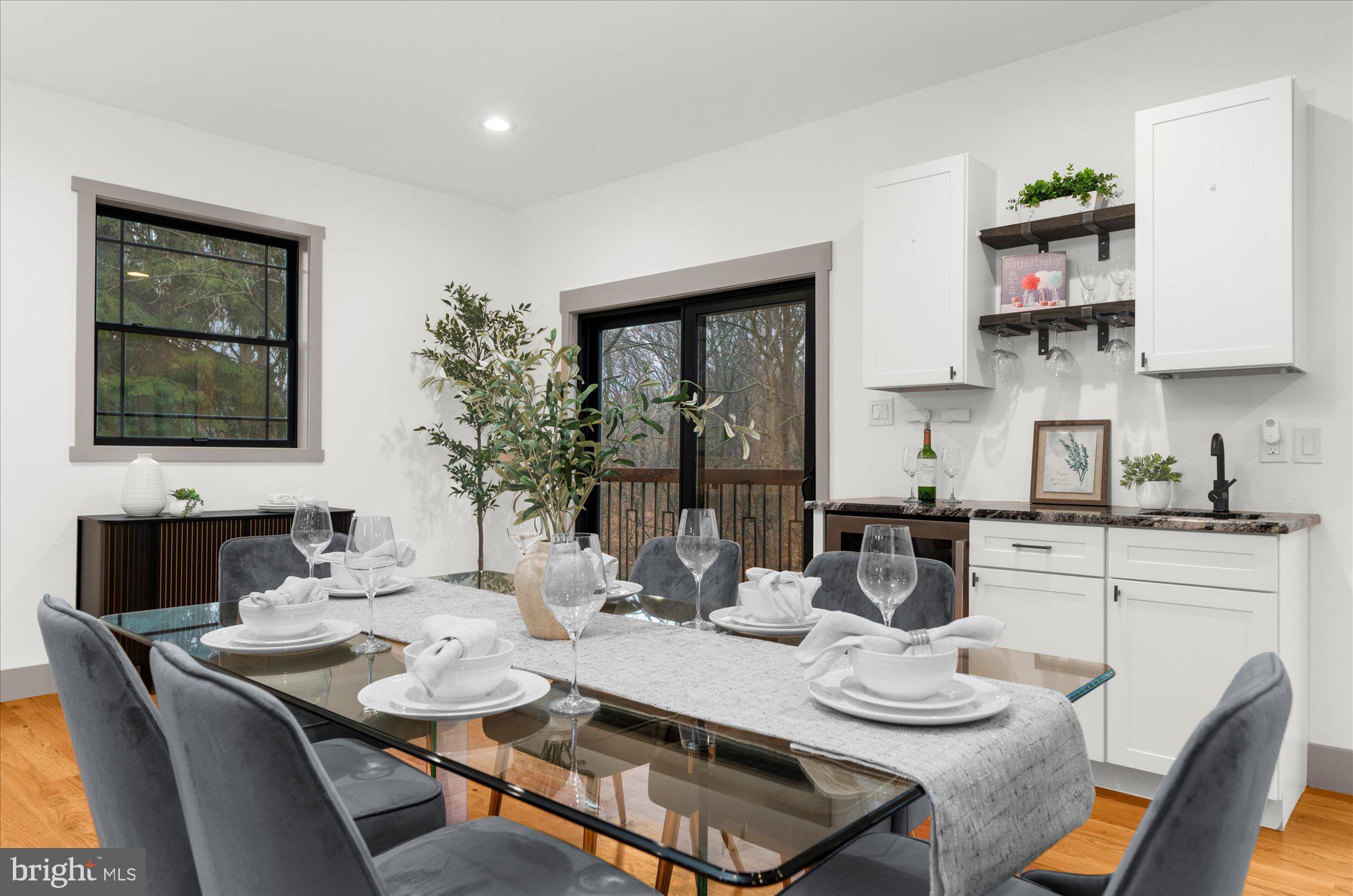 8 Chipmunk Lane Media, PA 19063 - Photo 9 of 51 a kitchen with a dining table and chairs