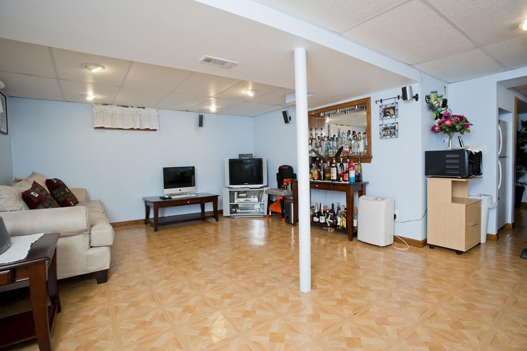 58 Acker Circle Chicopee, MA 01013 - Photo 15 of 17 a living room with furniture and a flat screen tv