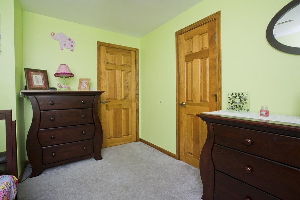 58 Acker Circle Chicopee, MA 01013 - Photo 8 of 17 a room with a dresser and a window