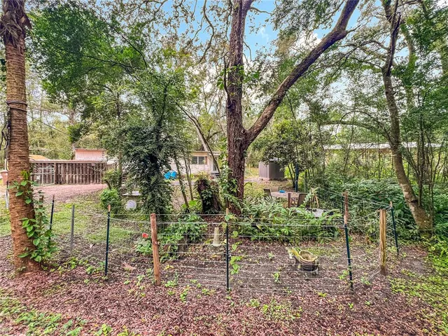a backyard of a house with lots of green space