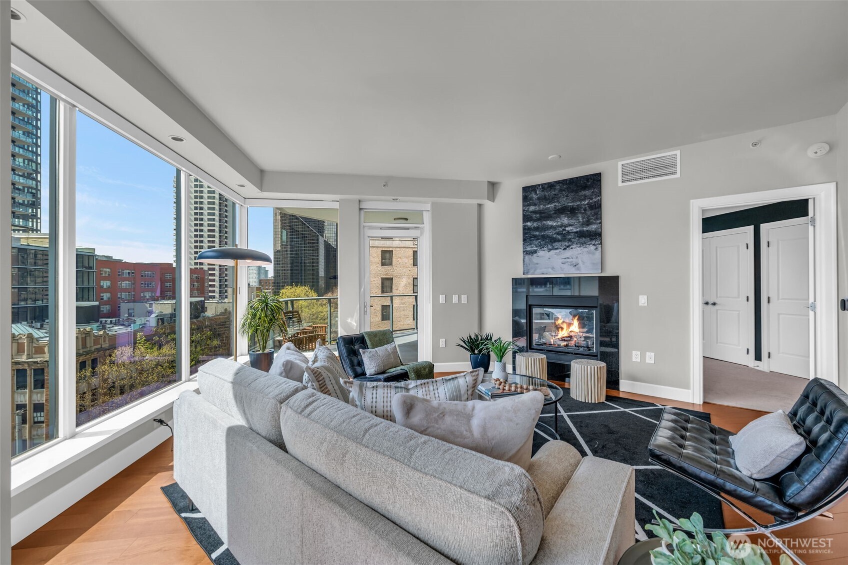 1920 4th Avenue, Unit 602 Seattle, WA 98101 - Photo 12 of 35 a living room with furniture and a fireplace