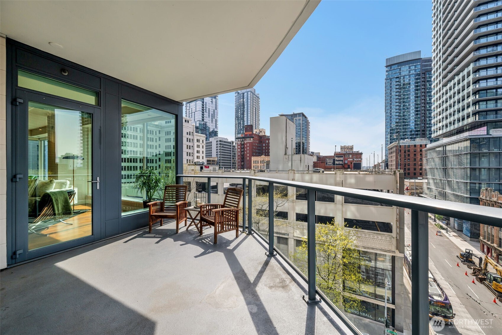 1920 4th Avenue, Unit 602 Seattle, WA 98101 - Photo 17 of 35 a view of a balcony with chairs