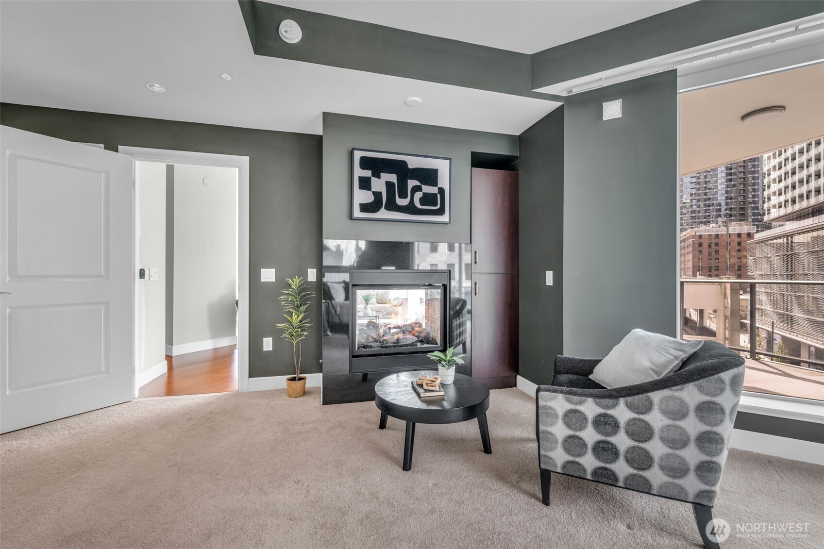 1920 4th Avenue, Unit 602 Seattle, WA 98101 - Photo 20 of 35 a living room with furniture and a painting on the wall