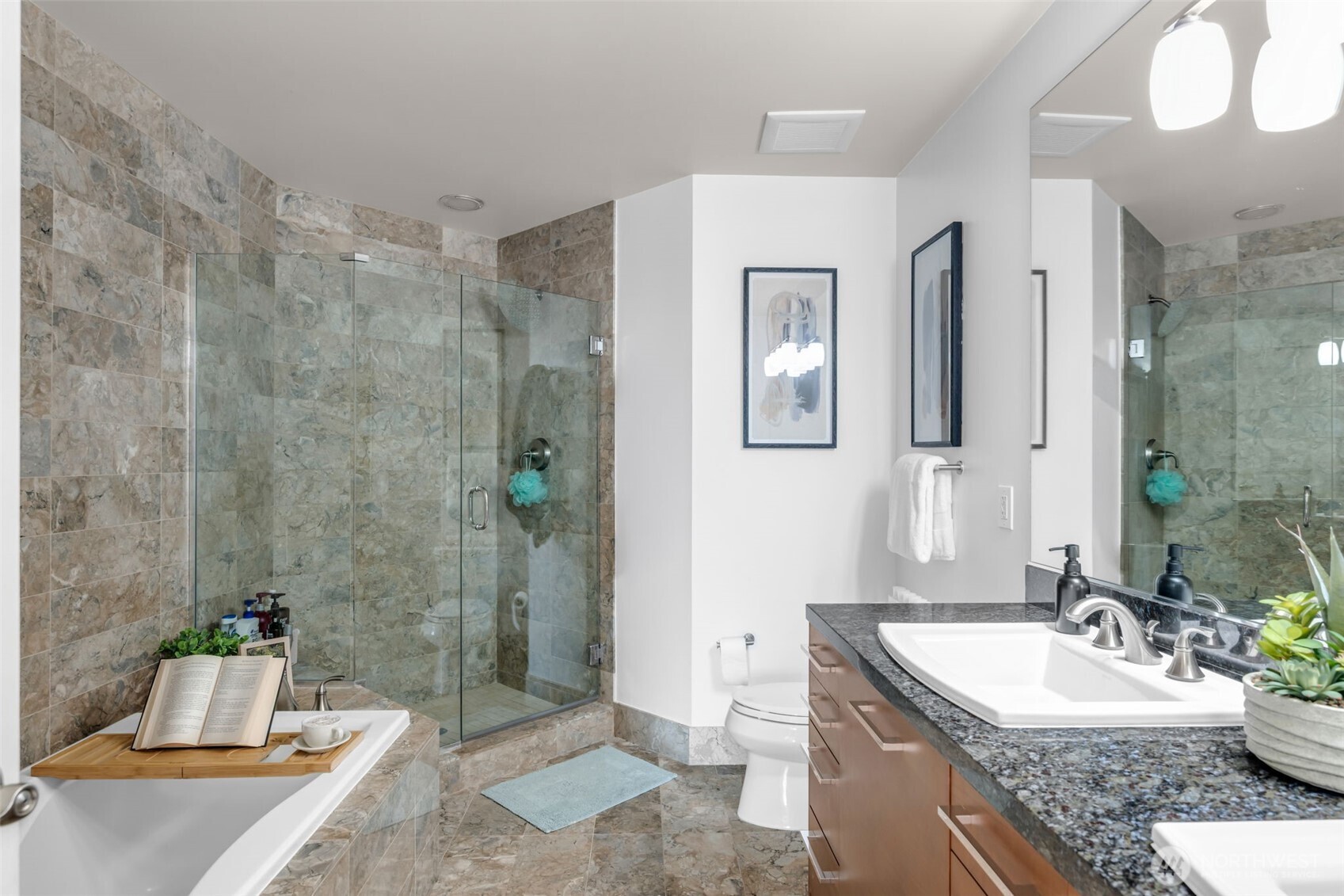 1920 4th Avenue, Unit 602 Seattle, WA 98101 - Photo 23 of 35 a spacious bathroom with a granite countertop sink mirror and a bathtub