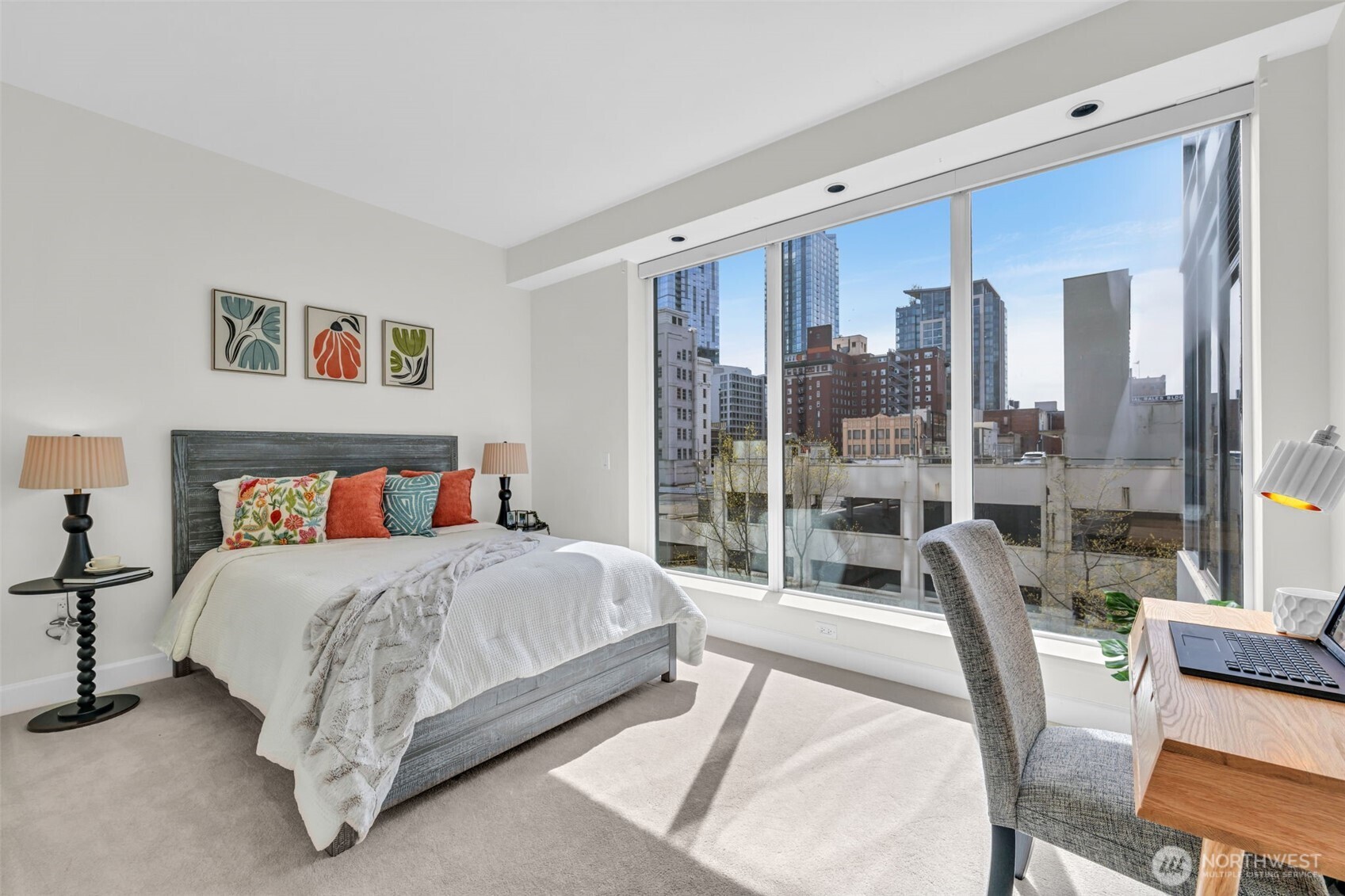 1920 4th Avenue, Unit 602 Seattle, WA 98101 - Photo 25 of 35 a bedroom with a large bed and a large window