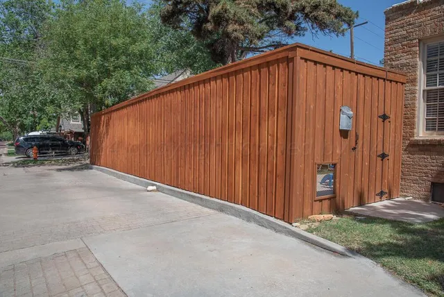 a dining room with furniture a chandelier and wooden floor
