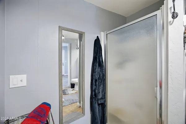 a bathroom with a shower and a tub