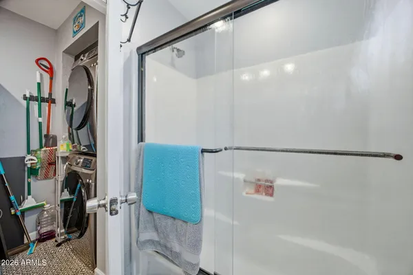 a bathroom with a bathtub and a shower