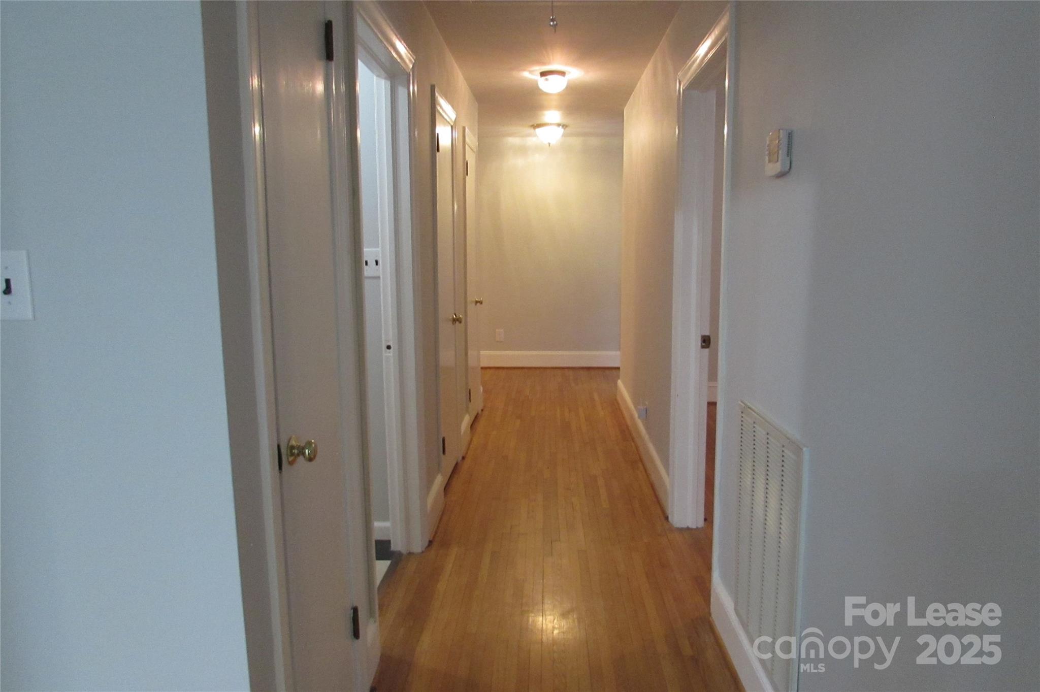 501 Dunham Road Gastonia, NC 28054 - Photo 12 of 28 a view of a hallway with wooden floor