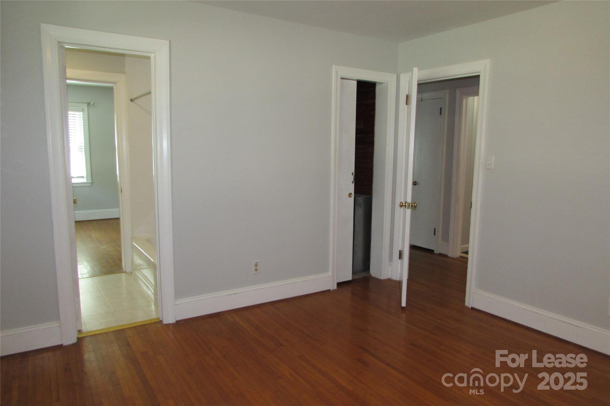 501 Dunham Road Gastonia, NC 28054 - Photo 13 of 28 an empty room with wooden floor and entrance