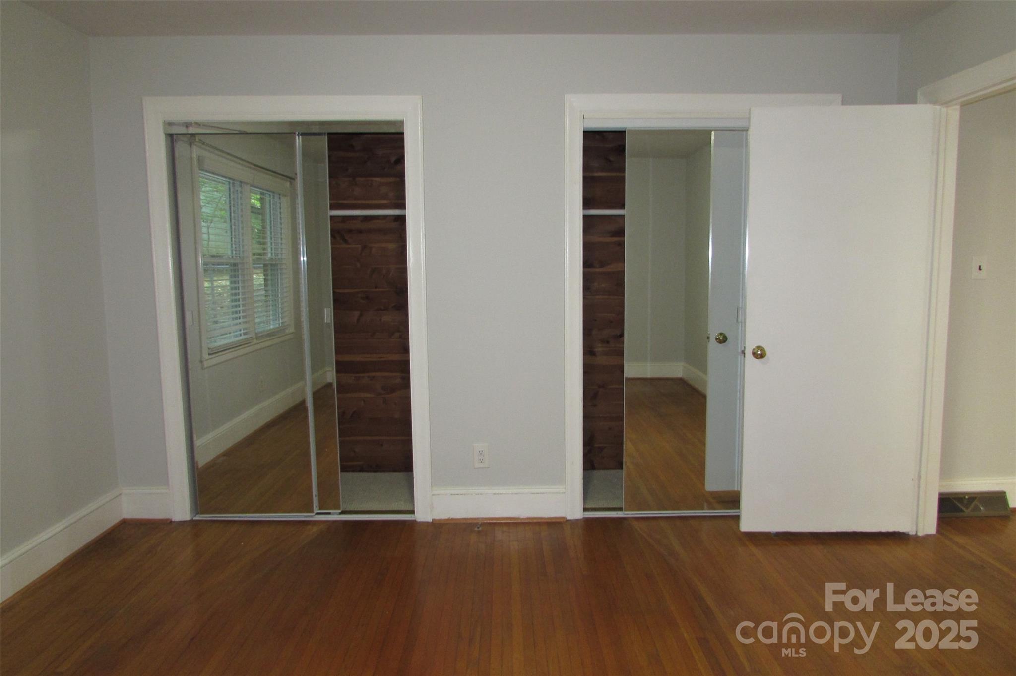 501 Dunham Road Gastonia, NC 28054 - Photo 21 of 28 an empty room with wooden floor and closet