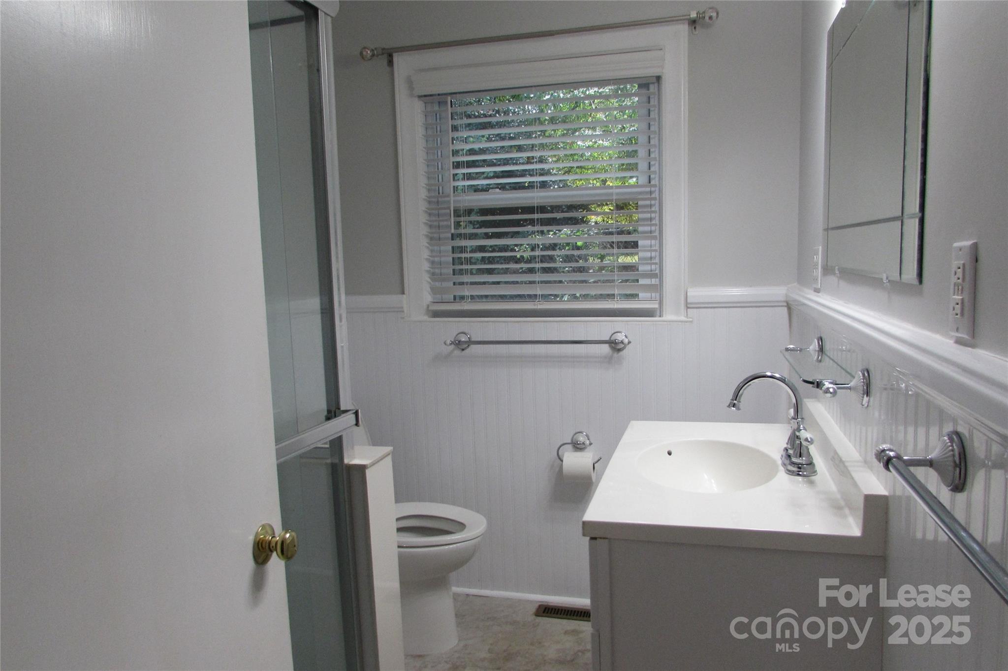 501 Dunham Road Gastonia, NC 28054 - Photo 22 of 28 a bathroom with a sink a toilet and a window