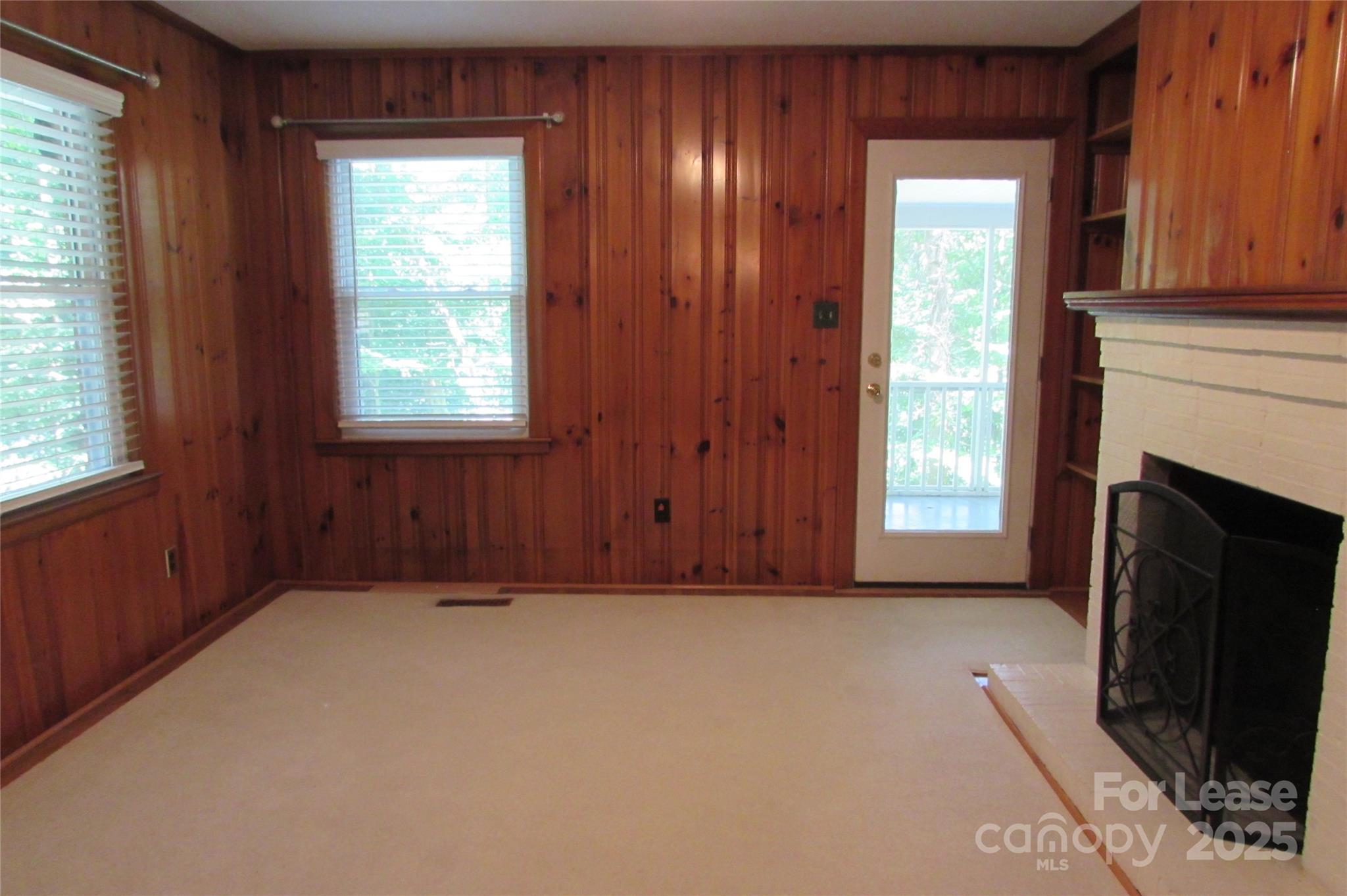 501 Dunham Road Gastonia, NC 28054 - Photo 7 of 28 a view of an empty room with a window and a fireplace