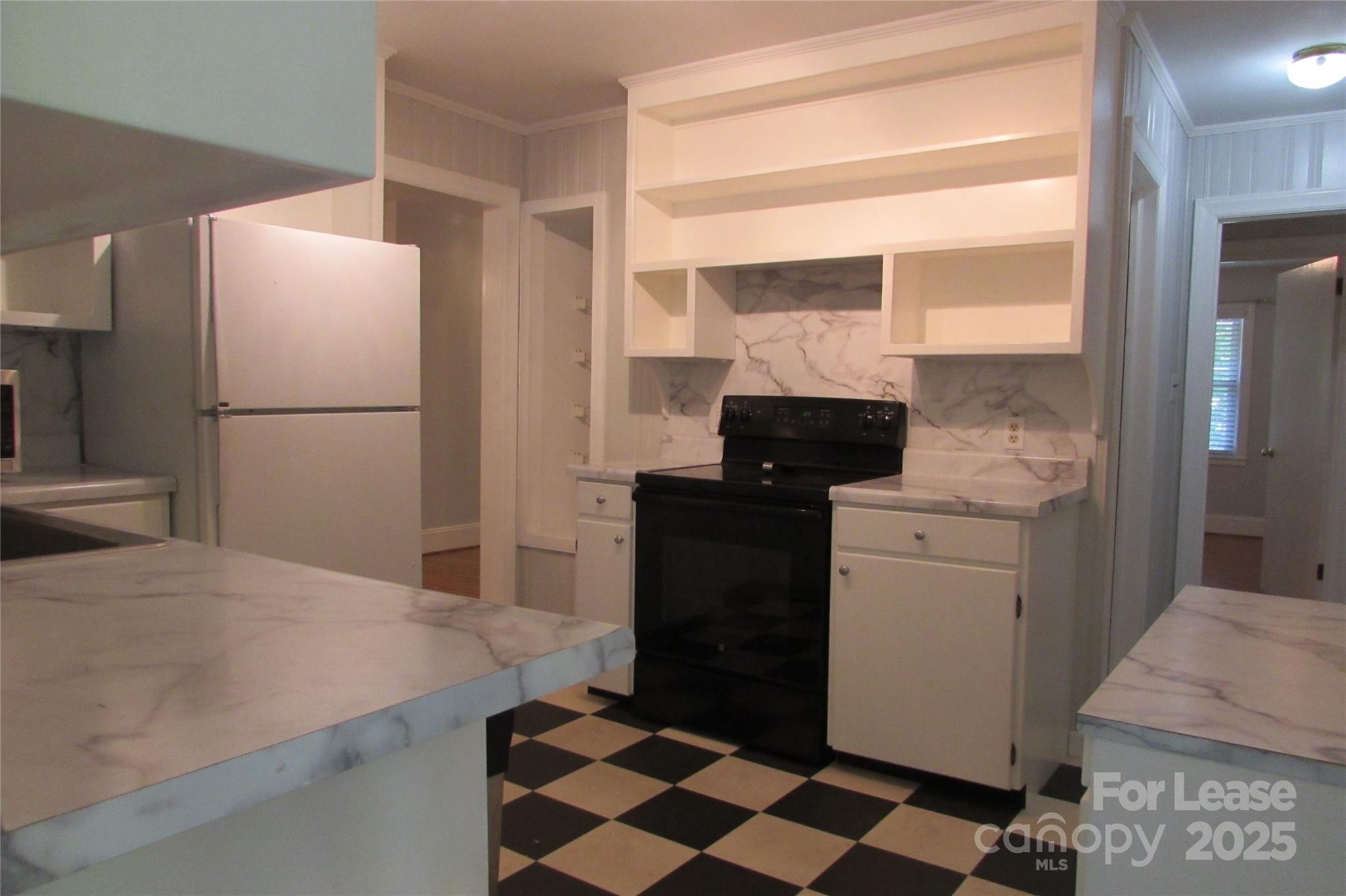 501 Dunham Road Gastonia, NC 28054 - Photo 10 of 28 a kitchen with a refrigerator and a stove top oven