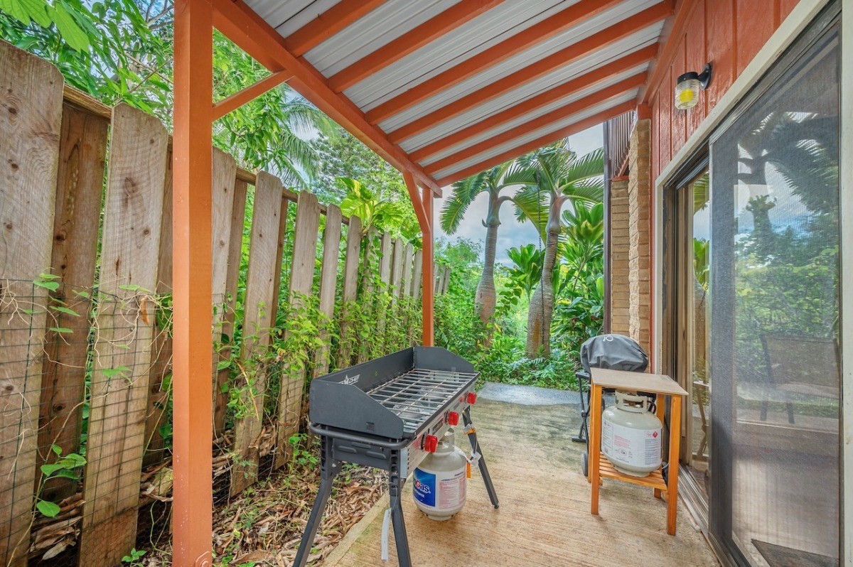 4698 Pelehu Road Kapaa, HI 96746 - Photo 25 of 26 a house view with a garden and outdoor seating