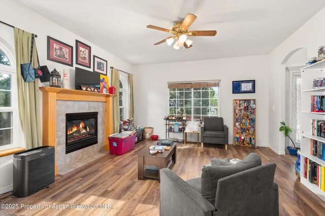 a living room with furniture and a fireplace
