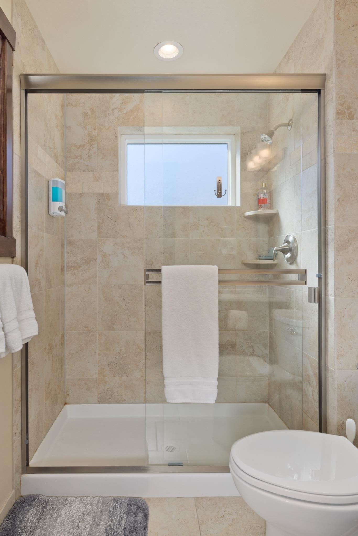 28 Oak Tree Way, Unit 8 Mammoth Lakes, CA 93546 - Photo 22 of 32 a bathroom with a granite countertop bathtub shower sink and toilet