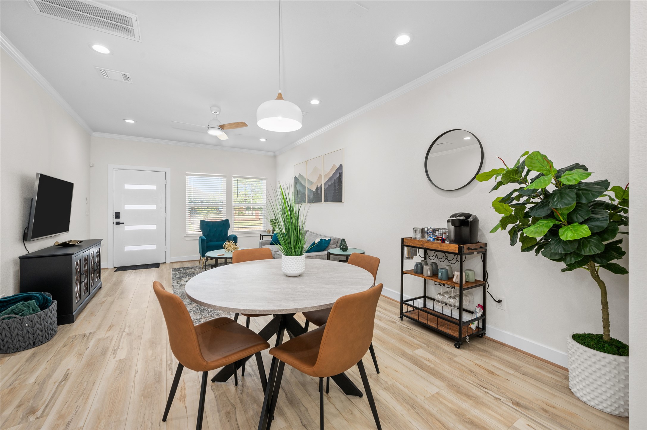 7089 Tierwester Street Houston, TX 77021 - Photo 13 of 35 a view of a dining room with furniture and wooden floor