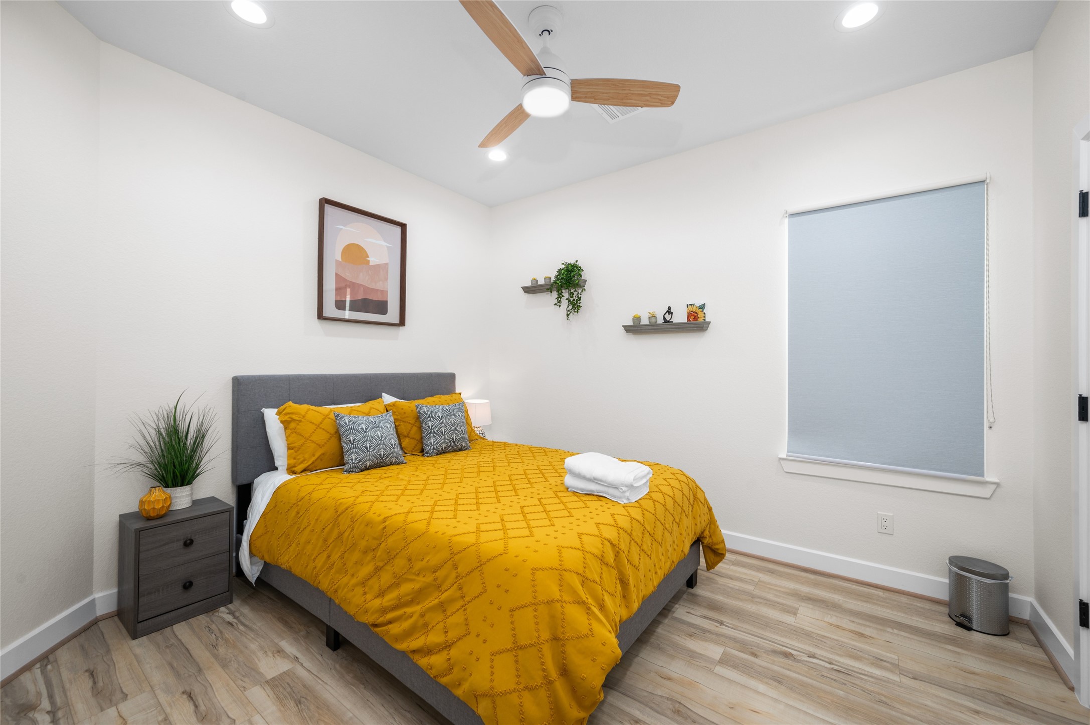 7089 Tierwester Street Houston, TX 77021 - Photo 26 of 35 a bed sitting in a bedroom next to a window