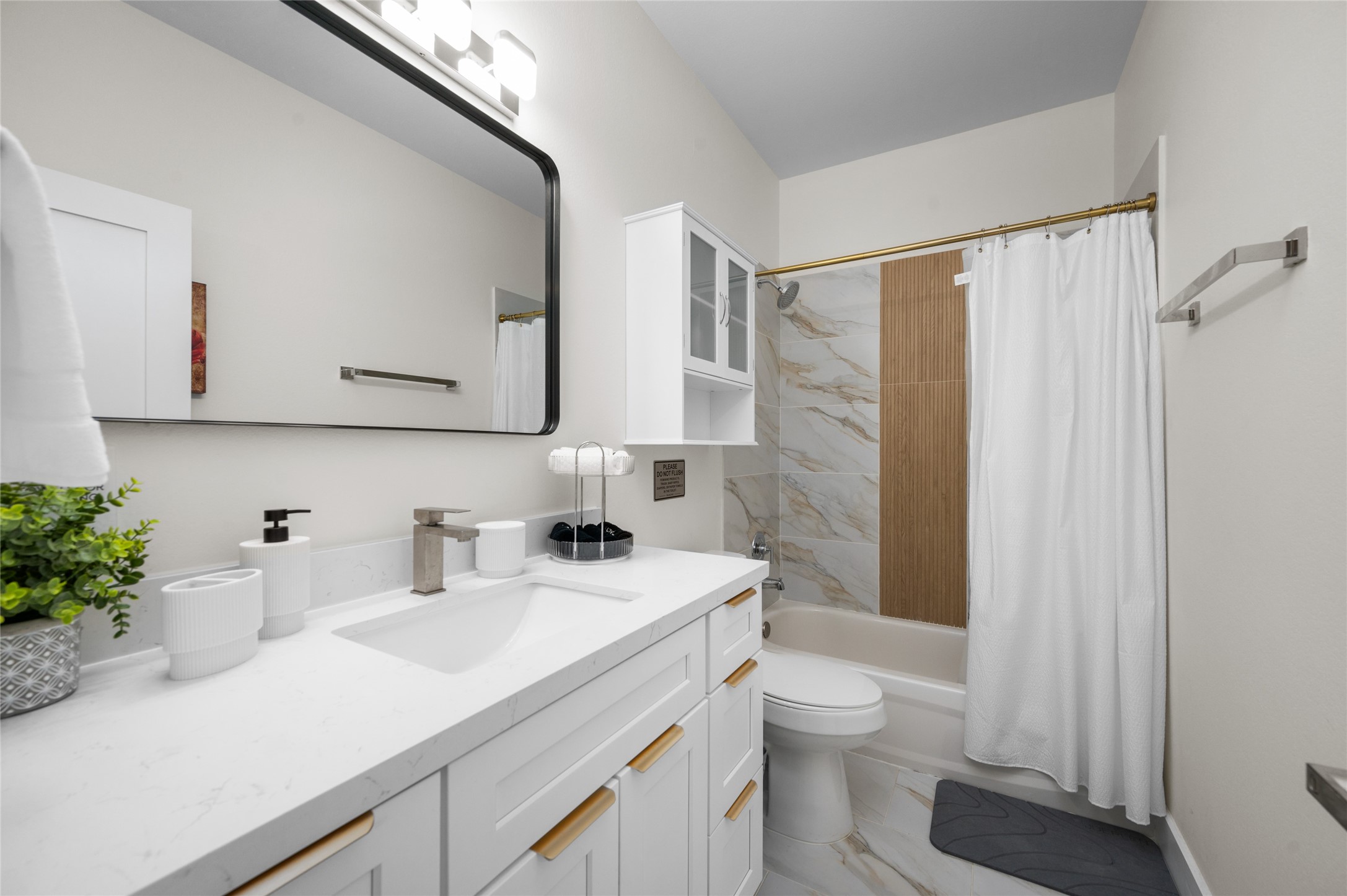 7089 Tierwester Street Houston, TX 77021 - Photo 32 of 35 a bathroom with a sink a toilet and shower