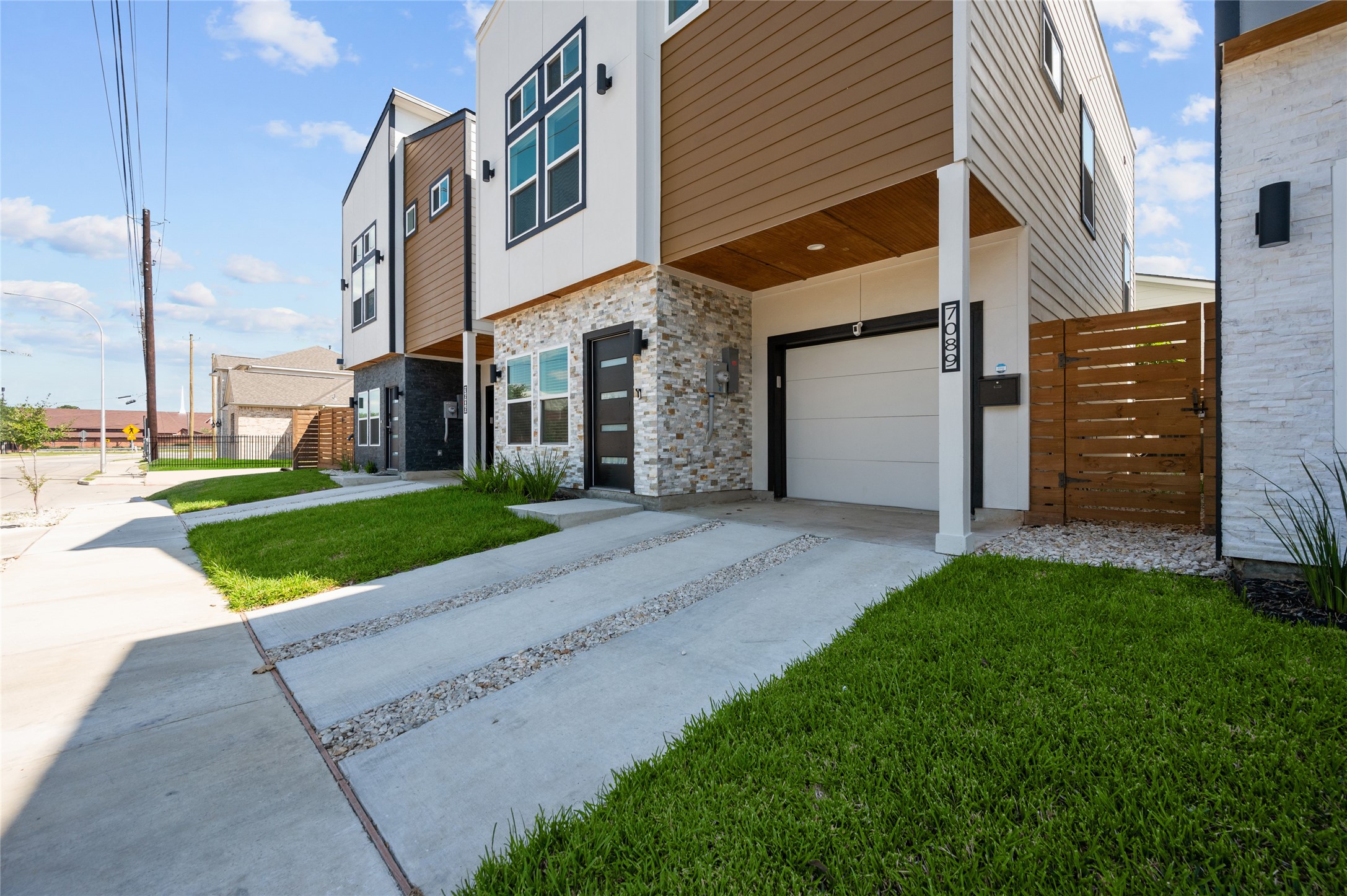 7089 Tierwester Street Houston, TX 77021 - Photo 5 of 35 a view of a house with a yard and many windows