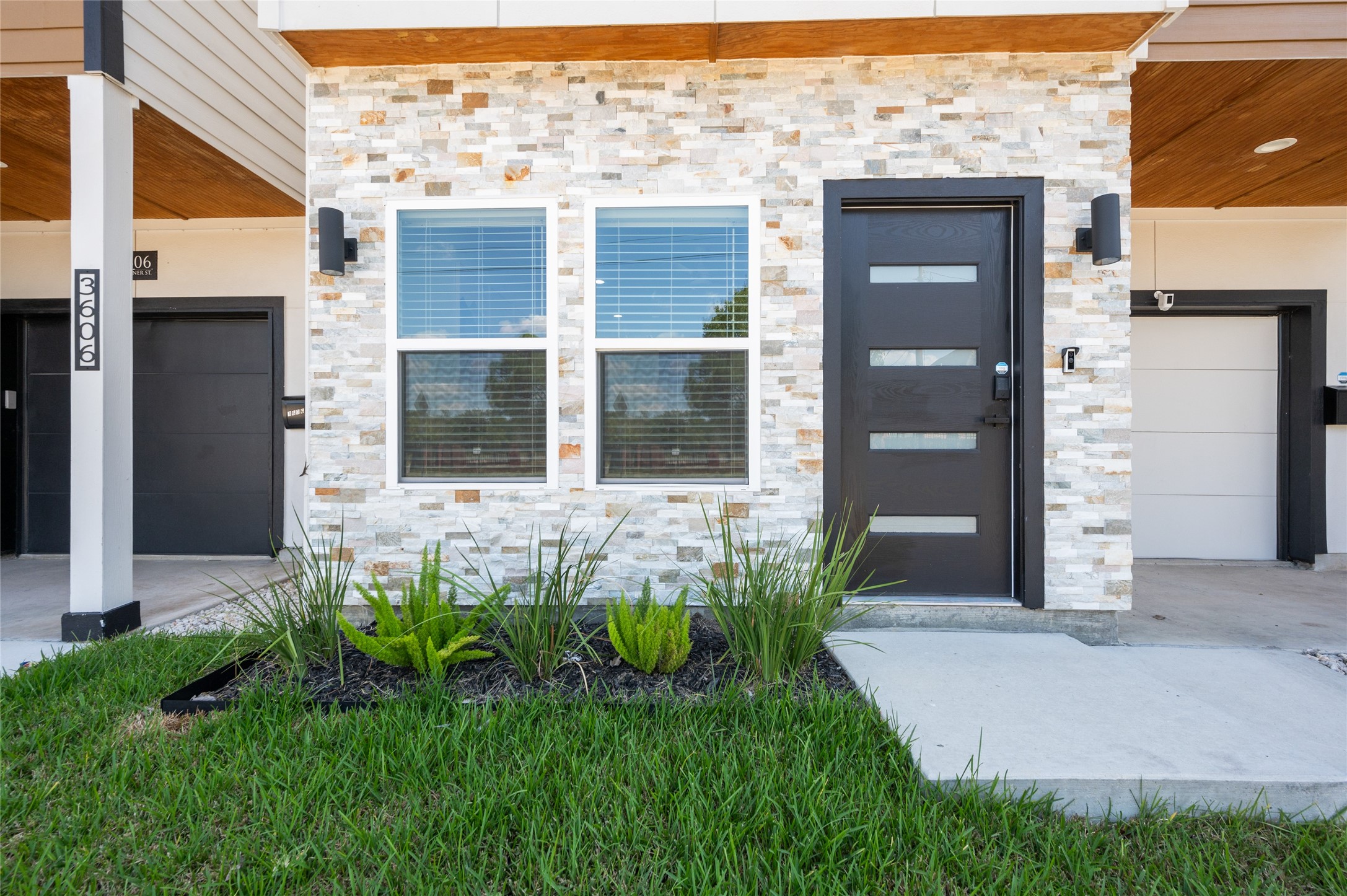 7089 Tierwester Street Houston, TX 77021 - Photo 7 of 35 a front view of a house with a garden