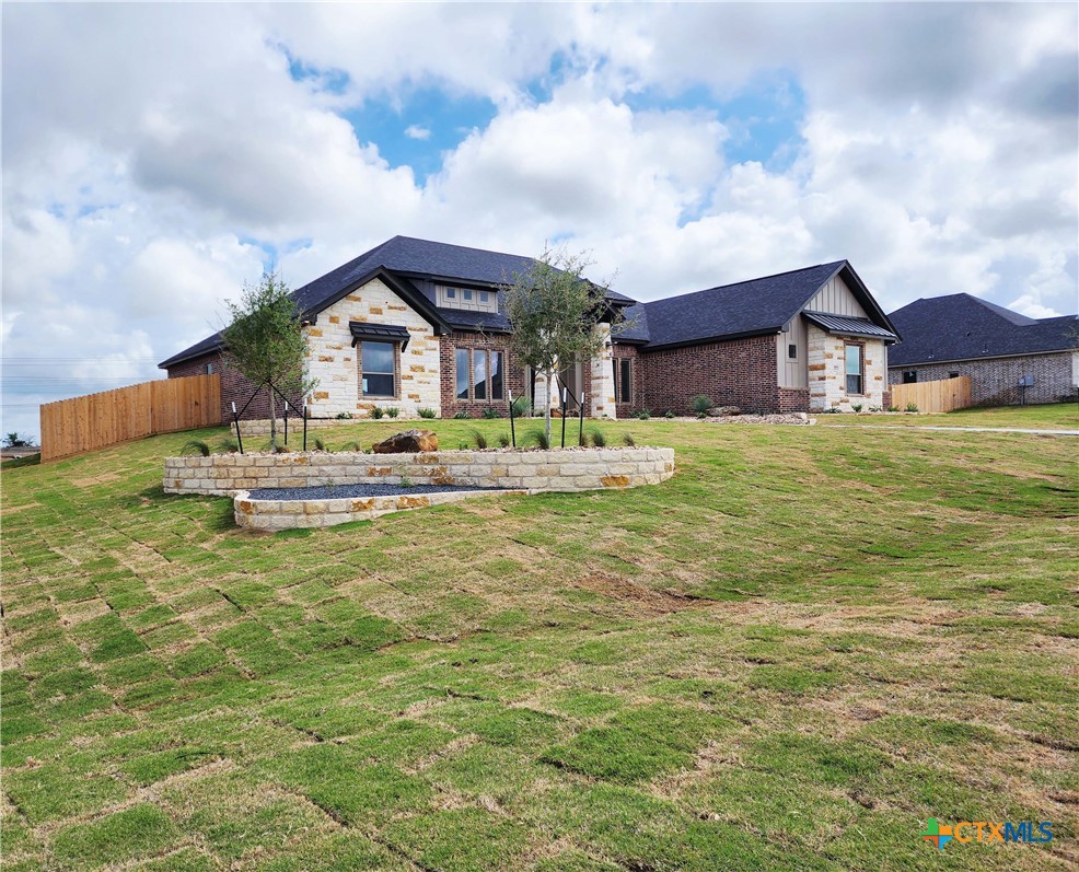 301 Rodeo Road Salado, TX 76571 - Photo 1 of 48 a house with huge green field in front of it
