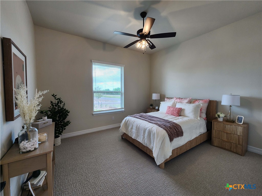 301 Rodeo Road Salado, TX 76571 - Photo 40 of 48 a bedroom with a bed and potted plant