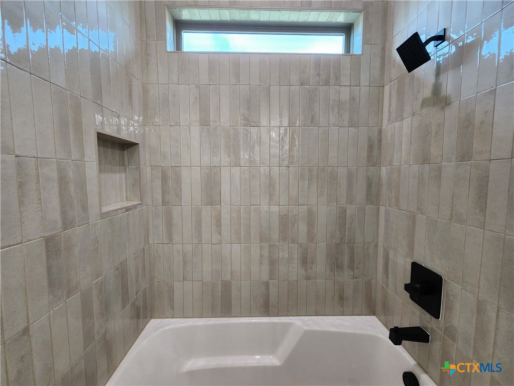 301 Rodeo Road Salado, TX 76571 - Photo 42 of 48 a bathroom with a bathtub and a shower