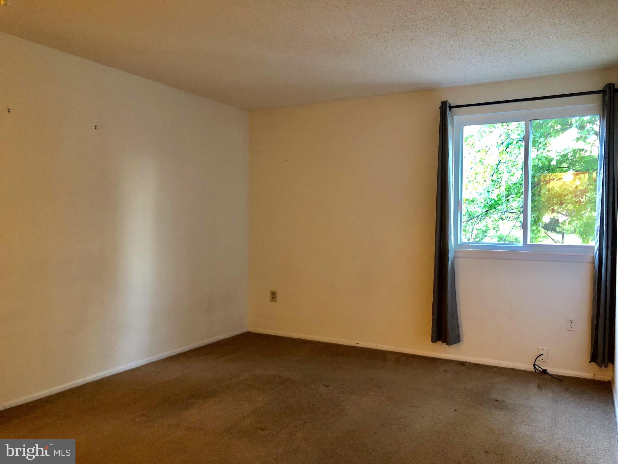 7197 A Cimarron Court Frederick, MD 21703 - Photo 12 of 23 a view of an empty room with a window