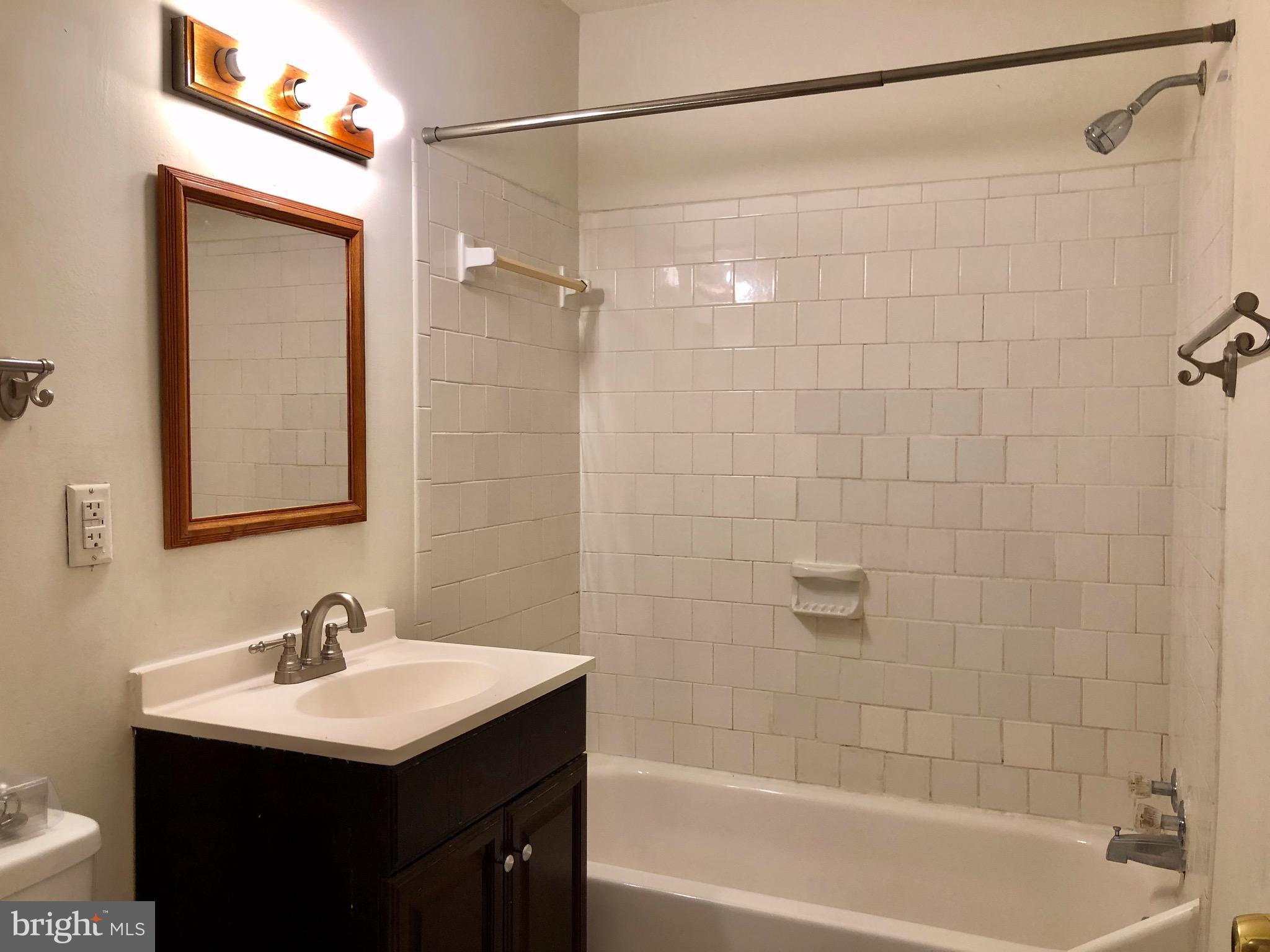 7197 A Cimarron Court Frederick, MD 21703 - Photo 16 of 23 a bathroom with a sink mirror toilet and bathtub