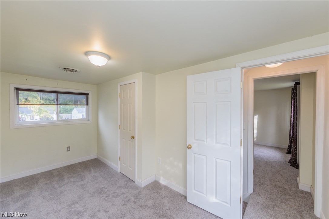 355 Dellwood Road Avon Lake, OH 44012 - Photo 25 of 35 Unfurnished bedroom featuring light carpet and a closet