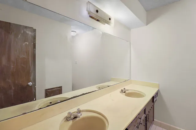 a bathroom with a sink and shower