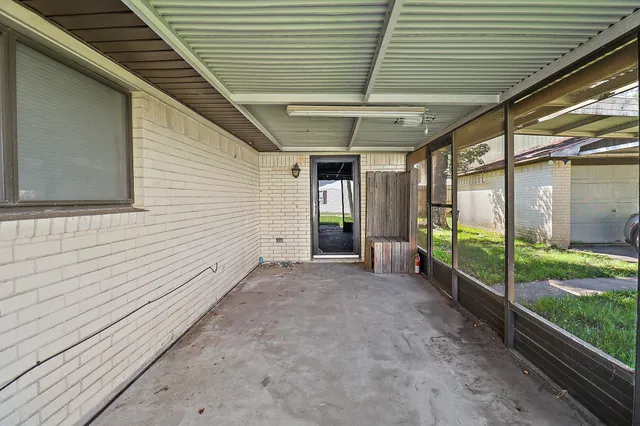 a view of a porch with wooden floor